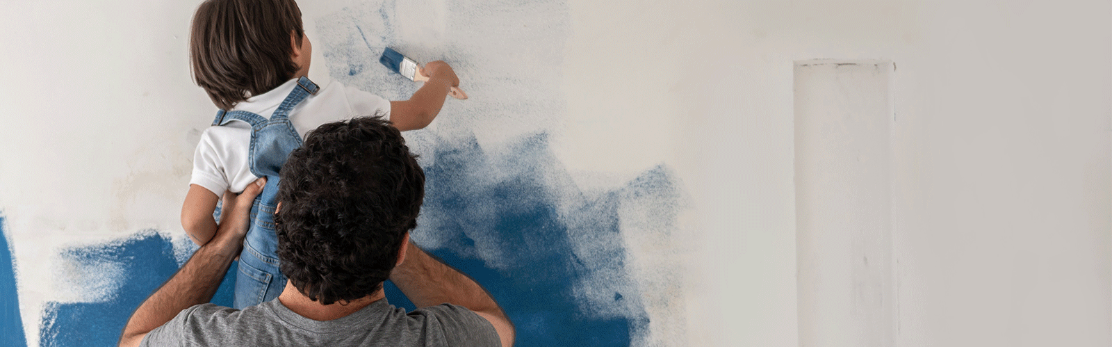 Dad and Child painting wall